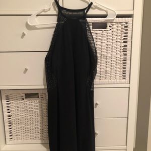 High neck black cocktail dress with glittery back